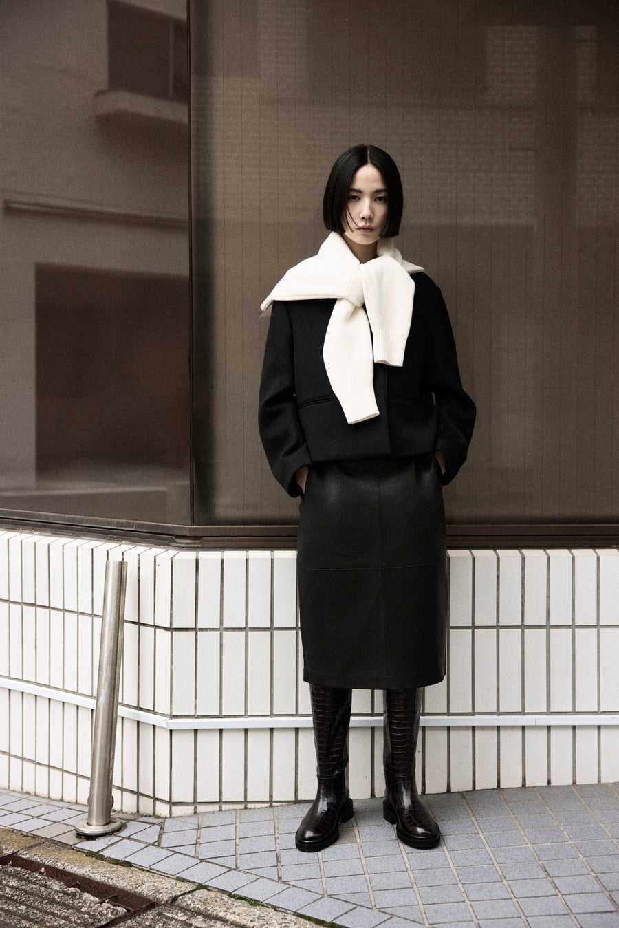 Tsugumi wears the Drew Jacket with the Wright Leather Skirt and Jude Knee High Boot.