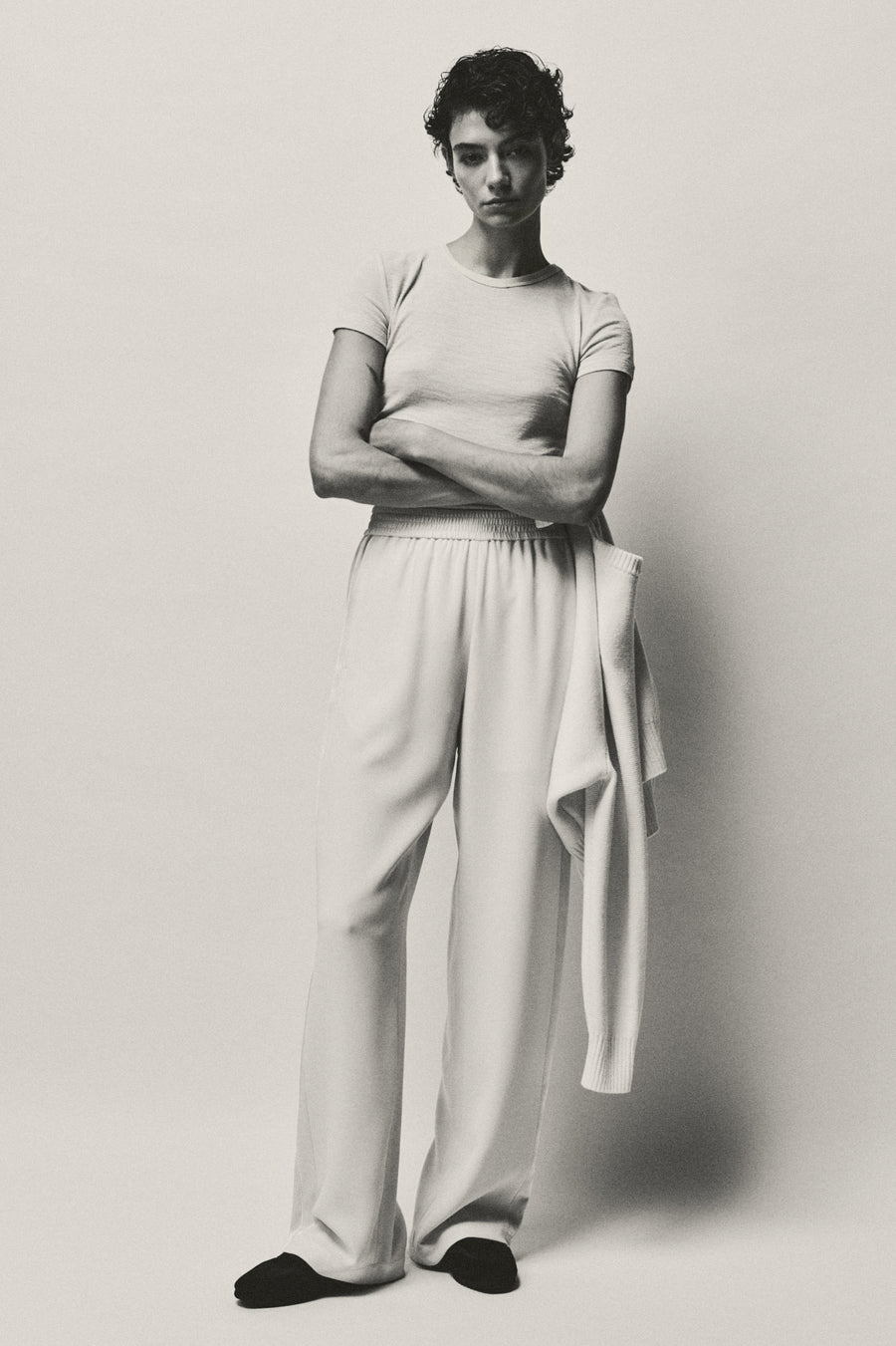 Anna Lee wears the Hendry Top and Angus Pant in Oyster with the Adams Sneaker in Black.