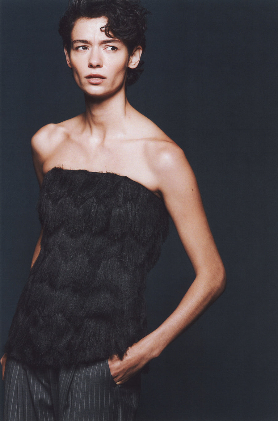 Anna Lee wears the Beaton Top in Black Fringe and Goddard Straight Pant in Charcoal Pinstripe.