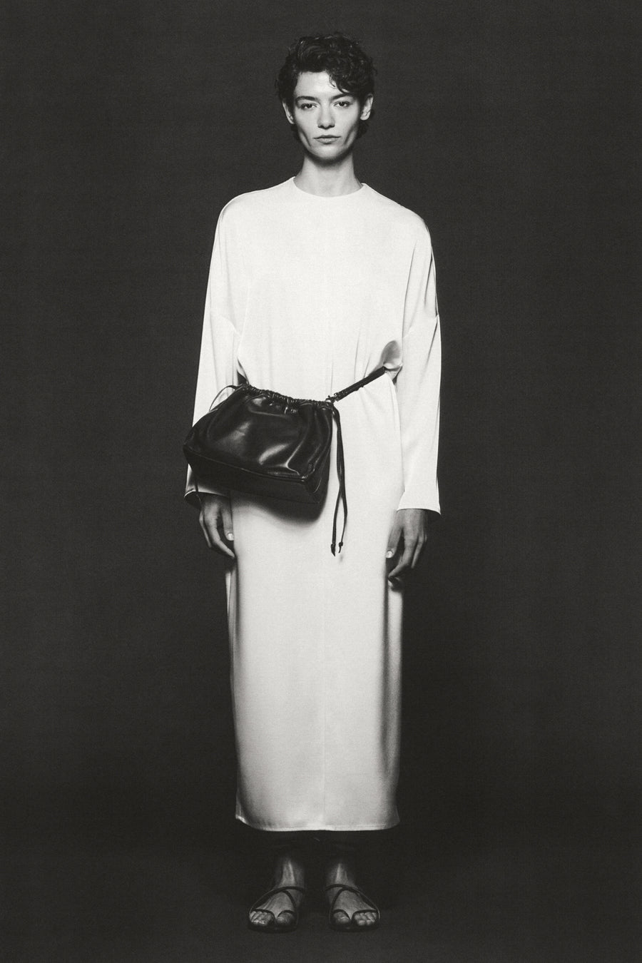 Anna Lee wears the Sisco Dress in Oyster with the Tobey Bag and Silas Sandals in Bistre.