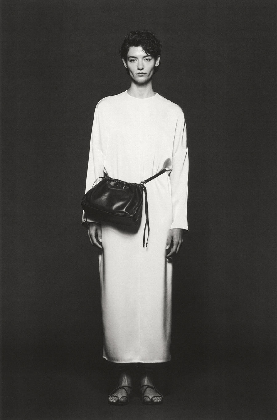 Anna Lee wears the Sisco Dress in Oyster with the Tobey Bag and Odine Sandal.