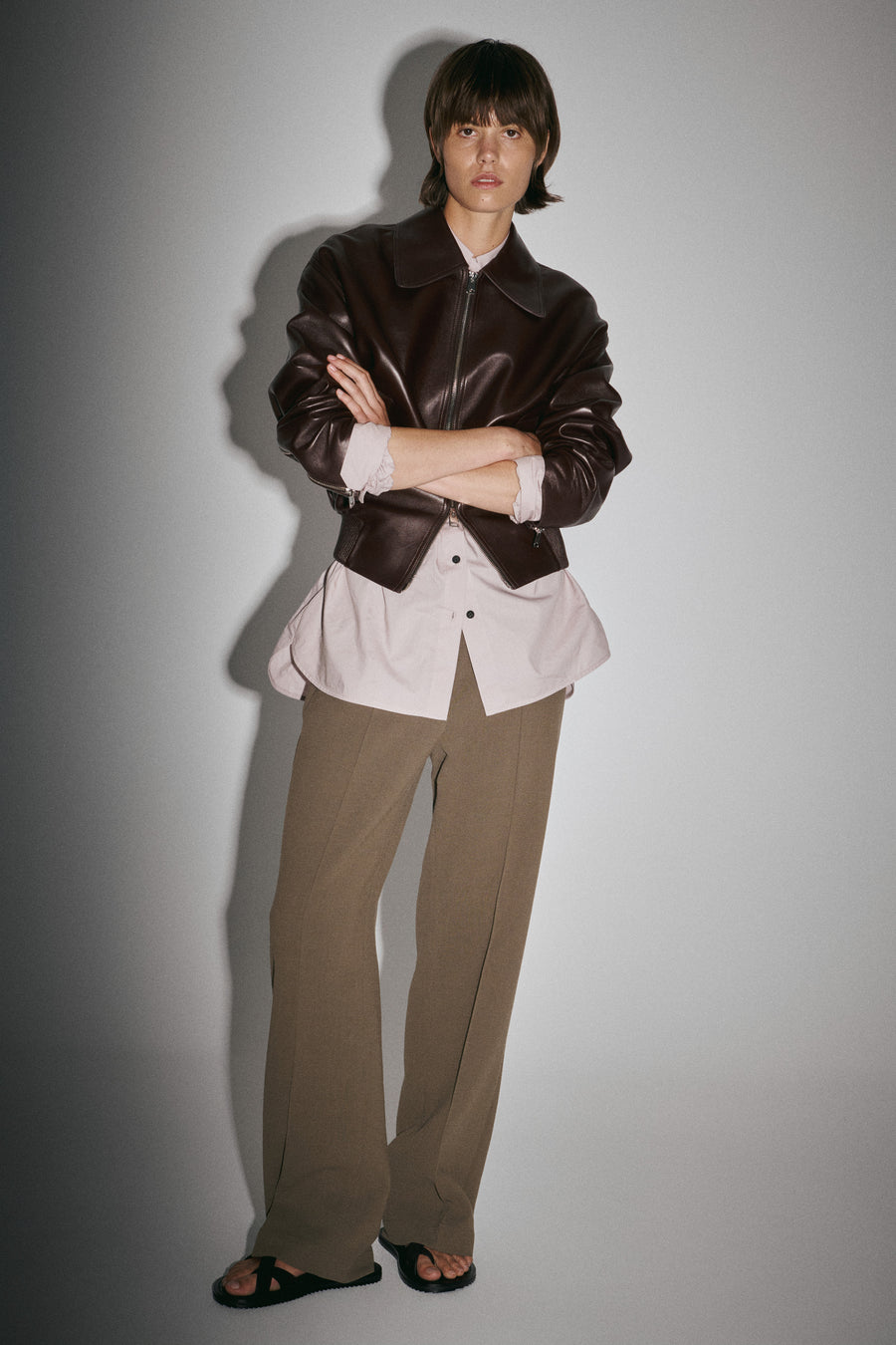 Jules wears the Vroman Leather Jacket over the Seth Shirt in Thistle with the Jacques Pant & Ora Sandal. 