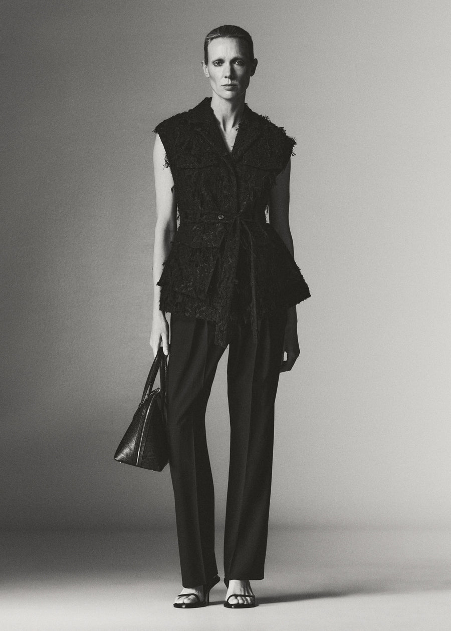 Annely wears the Jakob Vest with the Goddard Straight Pant, York Heeled Sandal & Harnick Top Handle Bag.