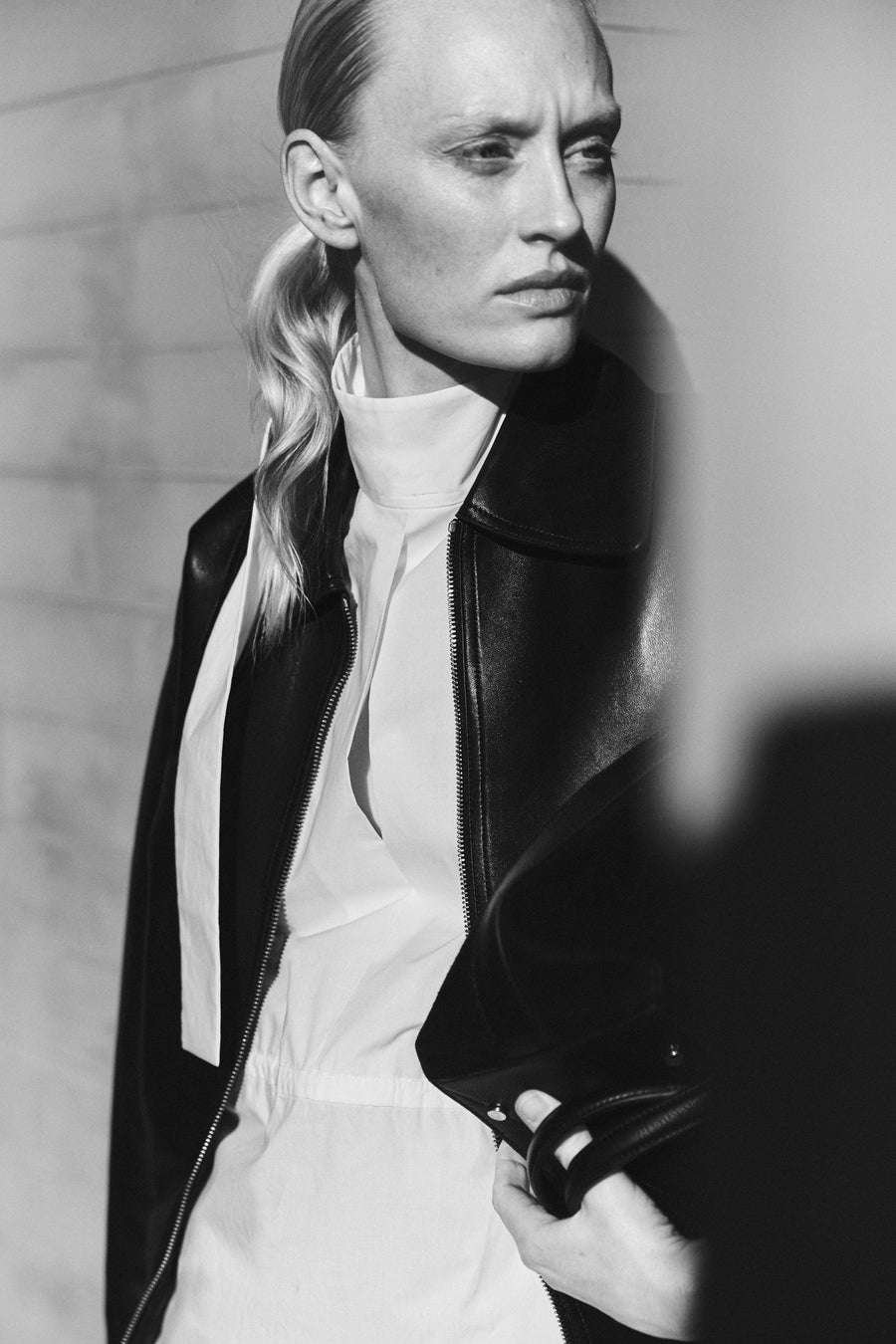 Luca wears the Vroman Leather Jacket in Black, the Miles Top in Lemon & the Wright Leather Skirt in Black