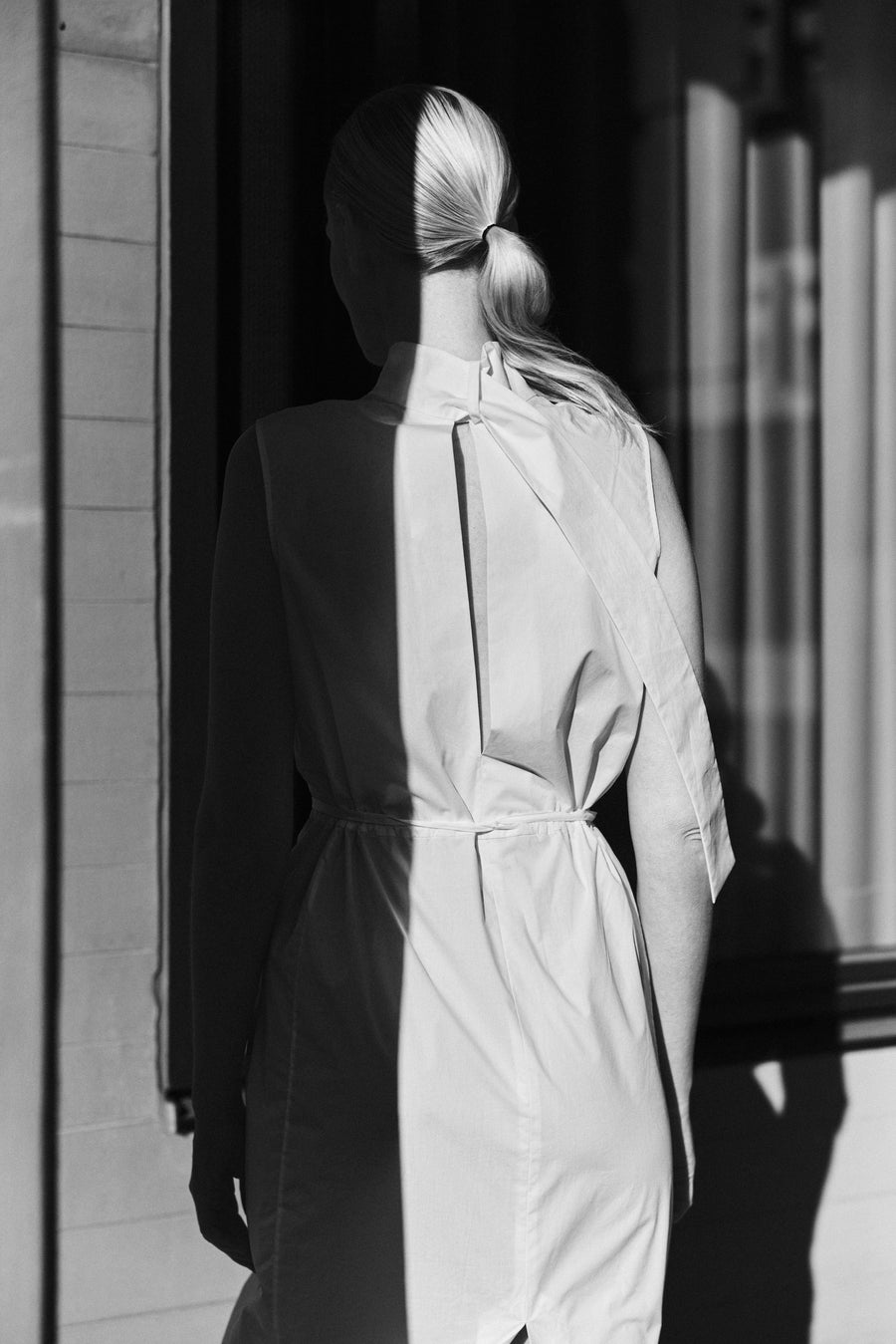 Luca wears the Ezra Dress in Parchment