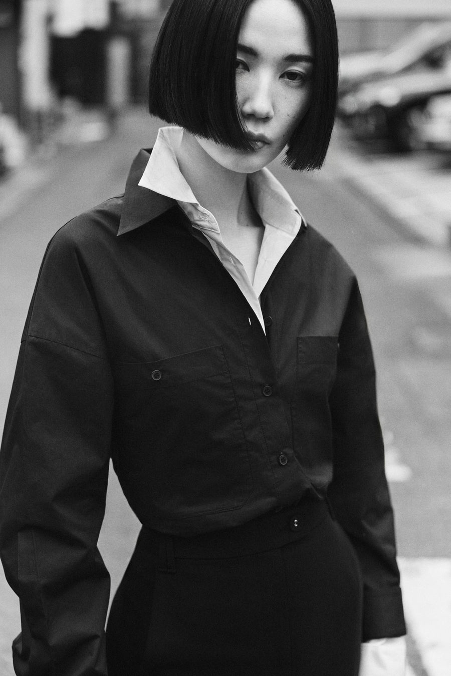 Tsugumi wears the Seth Shirt in both Black & Parchment with the Adrien Skirt.
